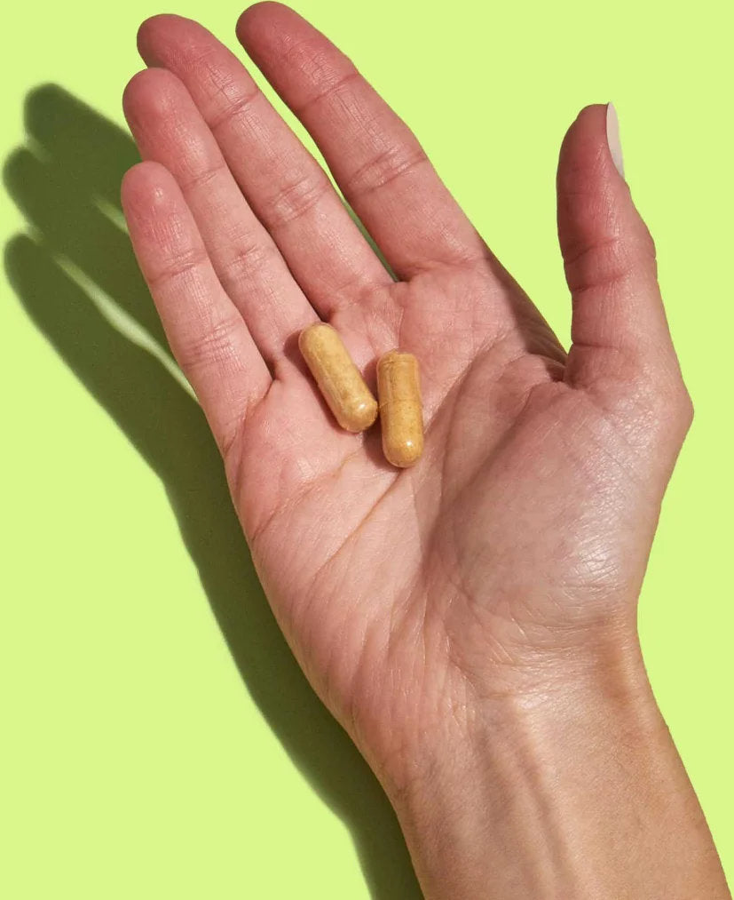 graphic of a hand holding Energy capsules