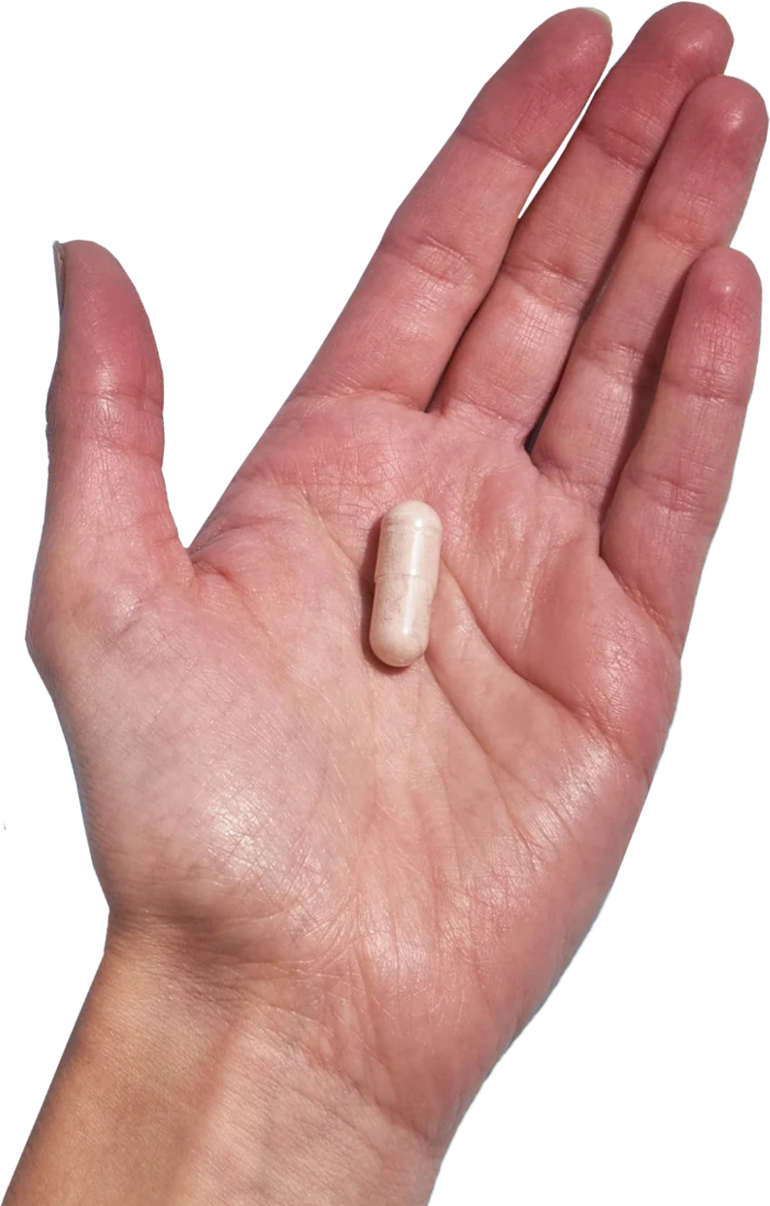 image of hand holding 1 Performance Lab® RoW Selenium capsule